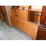 A Schreiber teak effect sideboard, height 111cm, width 152cm approx.