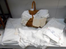 A quantity of mixed linen and a wicker basket