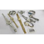 9 ladies manual wind and quartz watches including Bulova, Citizen, Ingersol.