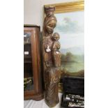 A tall carved figure of Madonna and child, 39" tall.