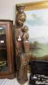 A tall carved figure of Madonna and child, 39" tall.