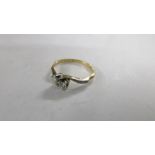 A diamond two stone twist ring, circa 1930's/40's,