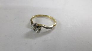 A diamond two stone twist ring, circa 1930's/40's,