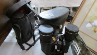 A cased pair of Pentax binoculars and one other.