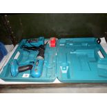 A Cased Makita power drill with charger