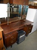 A triple mirror and darkwood dressing table, height 130cm,