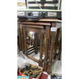 A nest of 3 good quality oak tables.