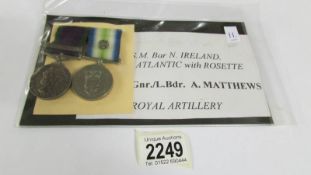 A South Atlantic medal with rosette and a G.S.M bar Northern Ireland to G.N.R A Matthews, R.A.