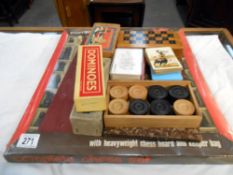 A boxed chess set (sealed in package) small chess set in box and 1 other chess set as well as 2