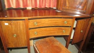 A Regency style mahogany inlaid sideboard.