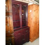 A darkwood stained glazed top dresser/display cabinet with cupboard/drawer base, height 187.