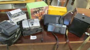 A mixed lot of photographic equipment including Kodak box Brownie, Fugi and Canon camera's,