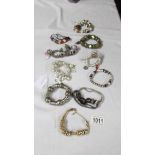 A collection of 9 Pandora style bracelets with charms etc.