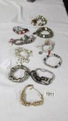 A collection of 9 Pandora style bracelets with charms etc.