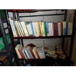 2 shelves of assorted books including 3 fairy books by Mary Cicely Barker and 4 books from the