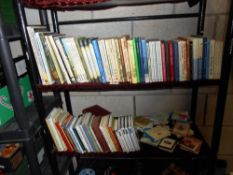 2 shelves of assorted books including 3 fairy books by Mary Cicely Barker and 4 books from the