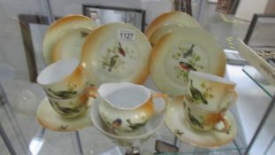 14 pieces of Victoria tea ware hand painted with birds.