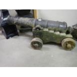 An old cast concrete good design cannon on stand.