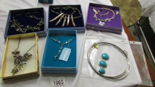 5 boxed necklaces (one with matching earrings) and one other.