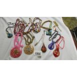 A mixed lot of colourful necklaces and pendants.
