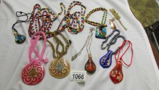 A mixed lot of colourful necklaces and pendants.