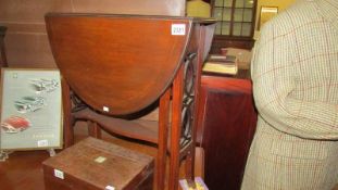 A mahogany inlaid Sutherland table.