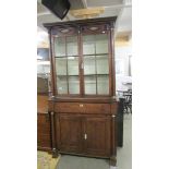 An early 19th century primitive oak dresser with bone embellishments.