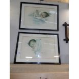 A pair of framed and glazed 1930's prints of babies.