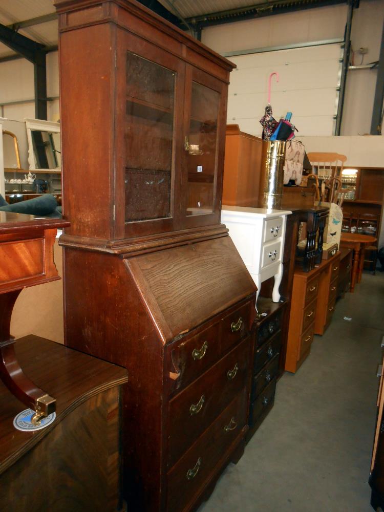 A 1920'30's oak bureau bookcase (lock and escutcheon in drawer and needs to be fixed back on),