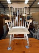 A vintage high stick back Windsor style arm chair