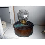 An unusual copper oil lamp with shade