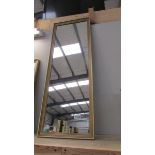 A long narrow gilt framed mirror, 97 x 35 cm.