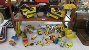 A collection of metal Tonka toys, digger etc.