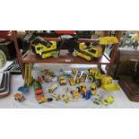A collection of metal Tonka toys, digger etc.