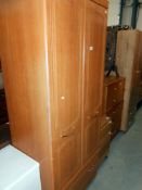 A 2 door Alstons furniture wardrobe with drawer at bottom, height 190cm, width 76.5cm approx.