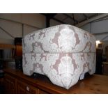 A large fabric covered foot stool on wheels, height 40cm,