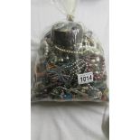 A bag of approximately 3kg of assorted costume jewellery.