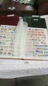 Five large stock books of stamps including Canada, Commonwealth, Australia etc.