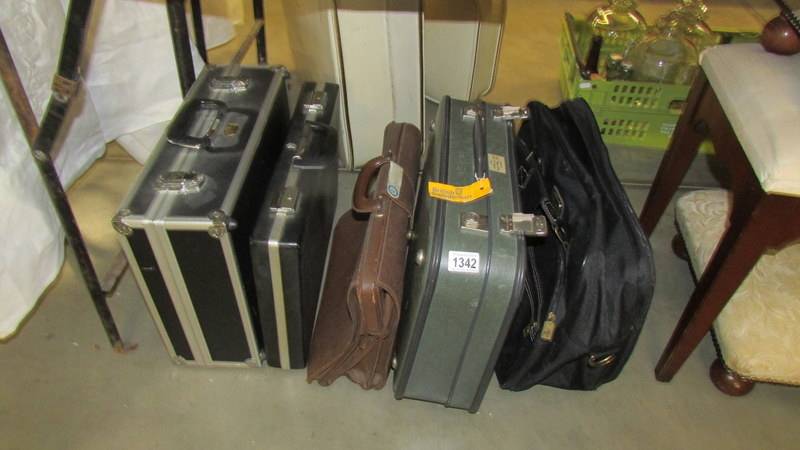 A quantity of briefcases, suit case, hard case etc.