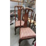 A pair of high back chairs.