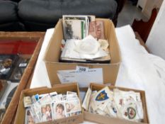 A box of ephemera including vintage postcards and photgraphs,