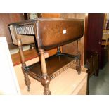 A 1930's oak drop side tea trolley, height 74cm, width 68cm, approx.