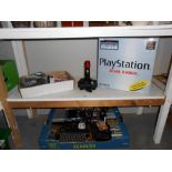 A large quantity of 80/90's Playstation console, controls,