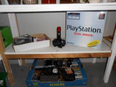 A large quantity of 80/90's Playstation console, controls,