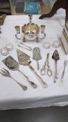 A silver plate table centrepieces, fish slice, cake slice, salad tongs, grape scissors etc.