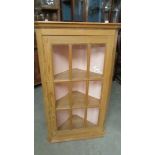 A good quality pine corner cupboard with glazed door.