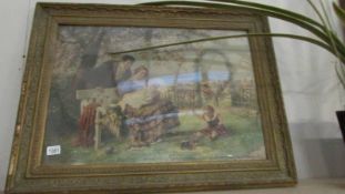 A framed and glazed garden scene depicting a family.