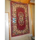 A 100% wool Chinese carpet in good condition, 152 x 91cm.