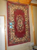 A 100% wool Chinese carpet in good condition, 152 x 91cm.