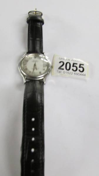 A Rolex Oyster perpetual date set wrist watch on replacement strap.